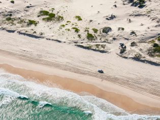 4WD driving along the beach on Worimi Conservation Lands, Port Stephens