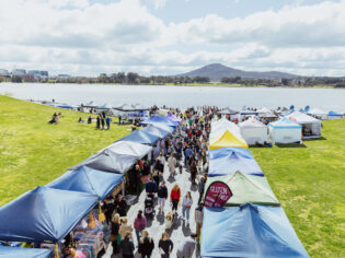 people shopping at the market stalls by the lake, The Little Burley Market, Canberra