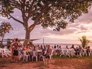 People relaxing at Darwin Ski Club at sunset